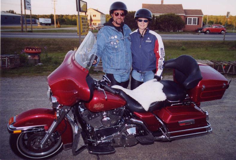 a smiling Ronnie from Alaska and his rented red bike with new sheepskin seat cover