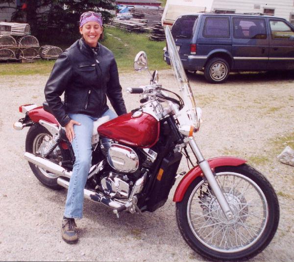 Woman on a red motorcycle